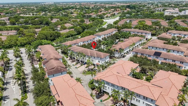 an aerial view of residential houses with outdoor space