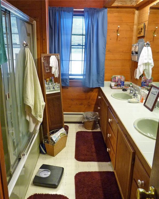1342 Otis Road Otis, ME 04605 - Photo 11 of 24 Full bath with double sink vanity.