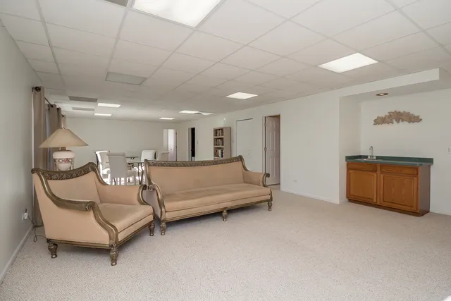 a spacious bedroom with a bed and a cabinets