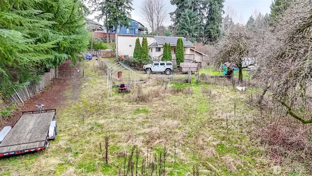 an aerial view of a house with a yard