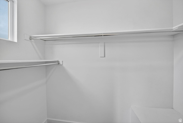 295 Spruce Way Santaquin, UT 84655 - Photo 20 of 32 Walk-in closet featuring white wire shelving, hanging rods, and a built-in corner shelf