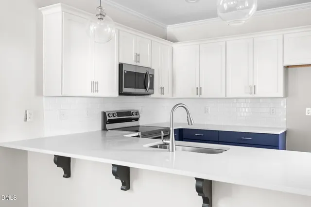 a view of a workspace with furniture and a potted plant