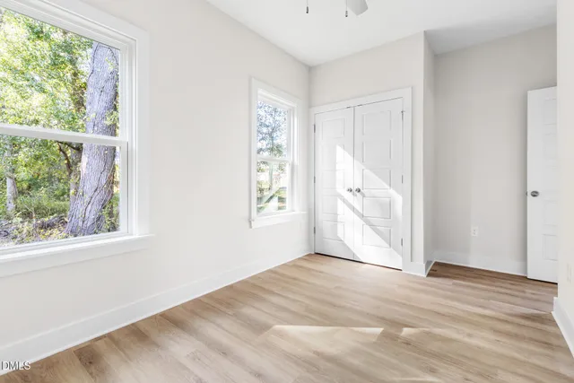 a bathroom with a sink a mirror and vanity