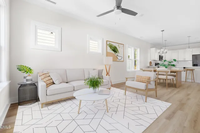 a living room with furniture and a table