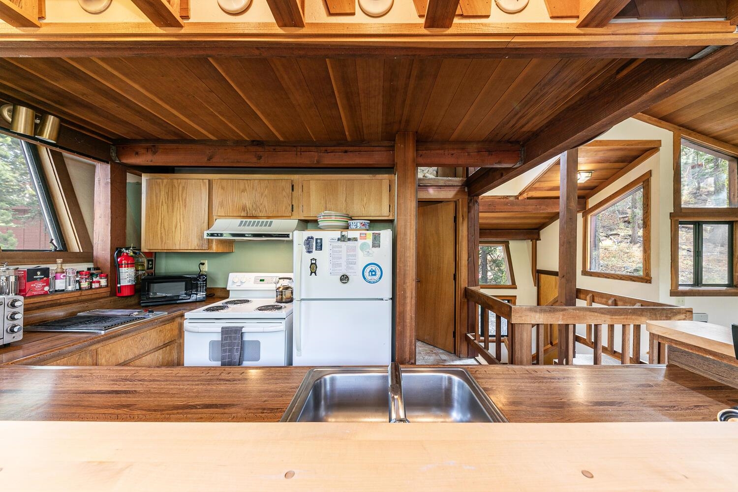 1786 Trapper Place Alpine Meadows, CA 96146 - Photo 6 of 16 a kitchen with stainless steel appliances granite countertop a stove and cabinets