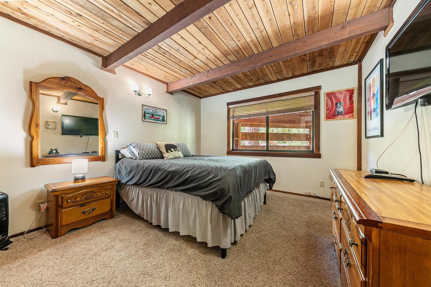 1786 Trapper Place Alpine Meadows, CA 96146 - Photo 10 of 16 a bedroom with a bed next to a window with outer view