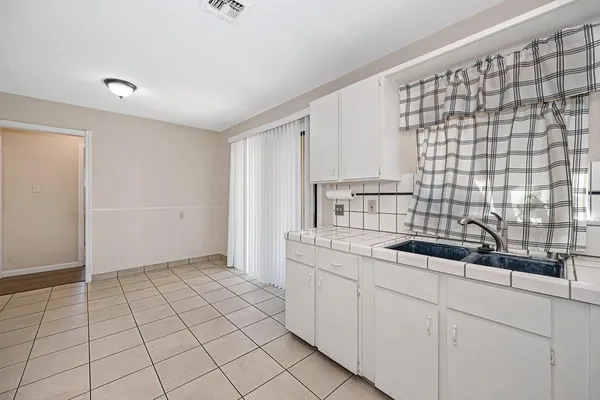 a kitchen with a sink and cabinets