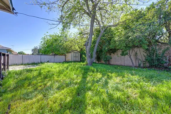 a backyard of a house with lots of green space