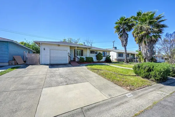 front view of a house with a garden
