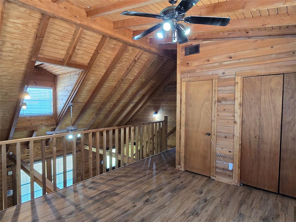3505 Farmer Road Azle, TX 76020 - Photo 24 of 40 A view of the stairs from the loft. Water heater closet has an electric ionizer already installed! Additional storage closet in the loft to meet your needs!