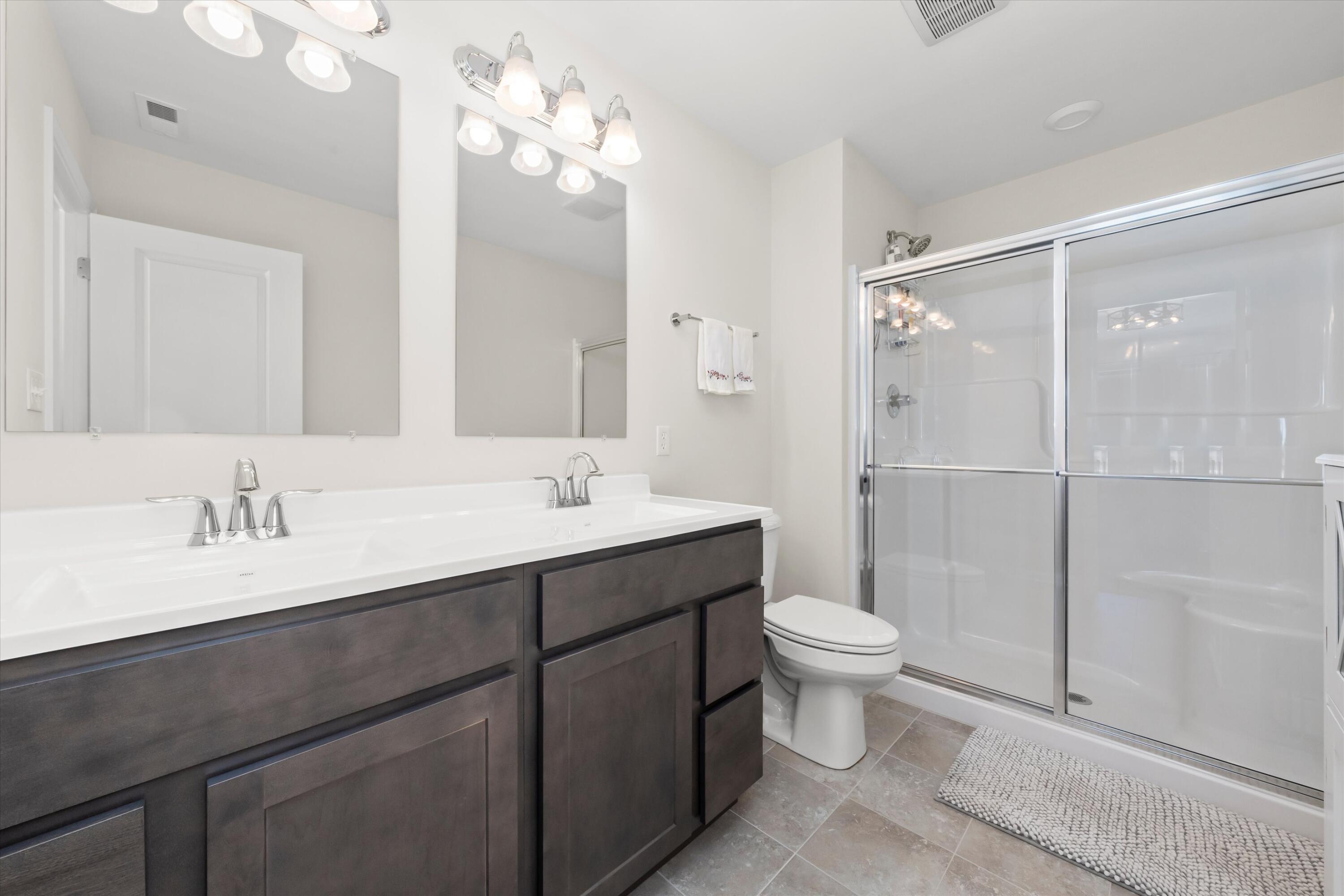 13665 Freedom Way Cedar Lake, IN 46303 - Photo 15 of 23 a bathroom with a sink a toilet a mirror and shower