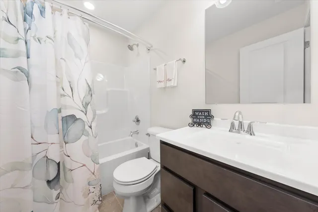 a bathroom with a sink a toilet and a bathtub