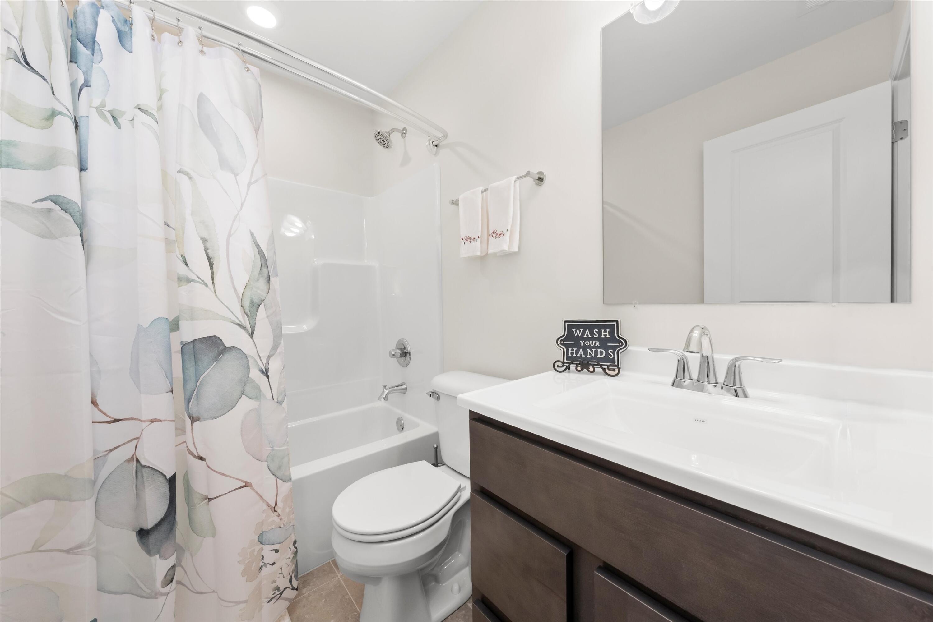 13665 Freedom Way Cedar Lake, IN 46303 - Photo 17 of 23 a bathroom with a sink a toilet and a bathtub