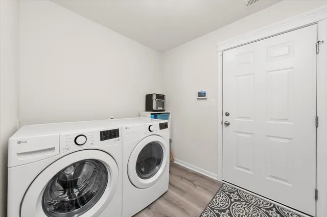 a view of storage and utility room with washer and dryer