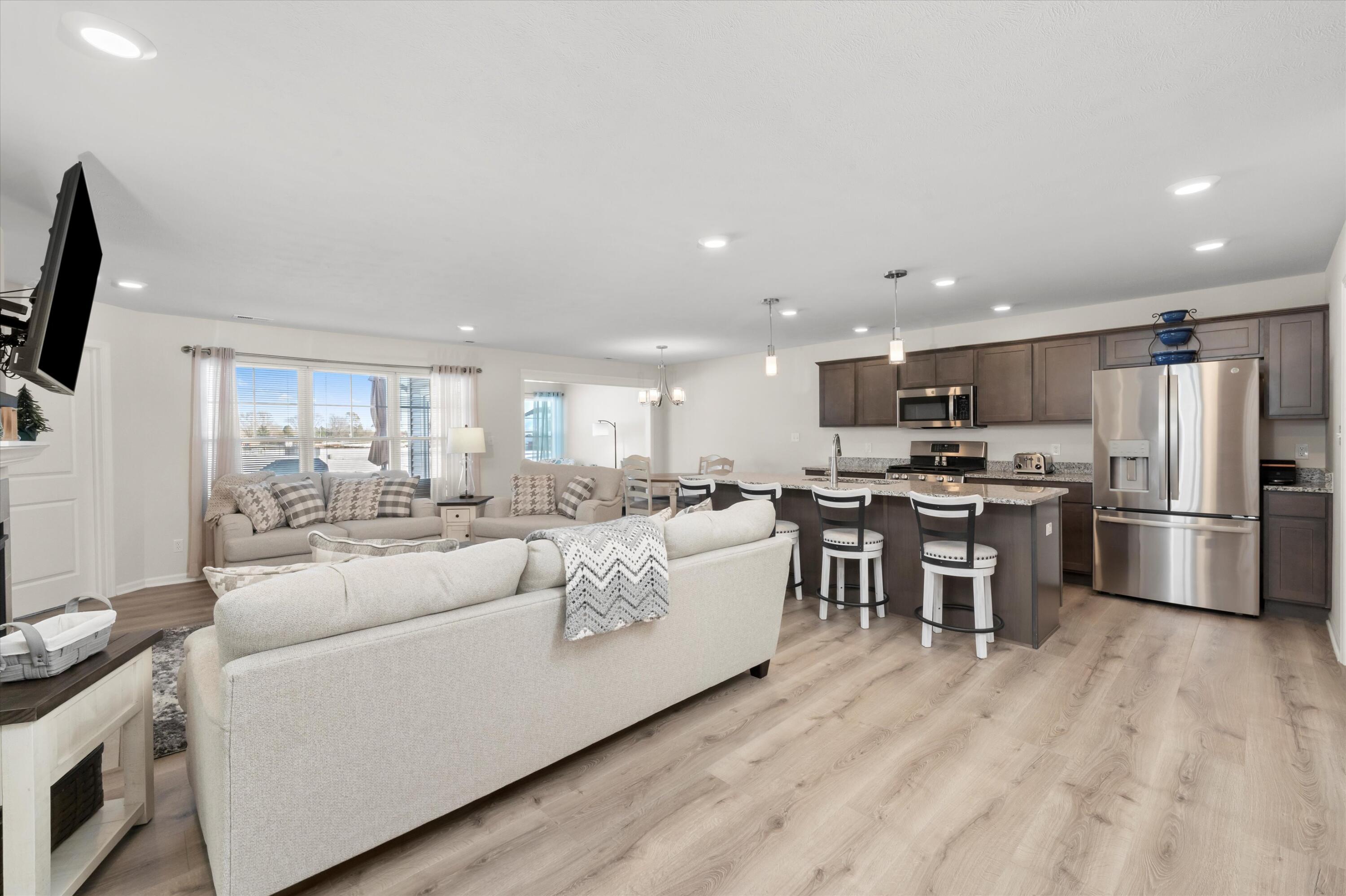 13665 Freedom Way Cedar Lake, IN 46303 - Photo 4 of 23 a living room with stainless steel appliances furniture and a kitchen view