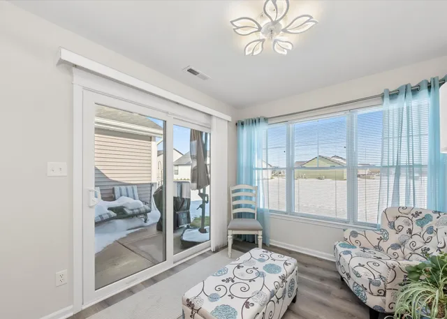 a bedroom with furniture and a window