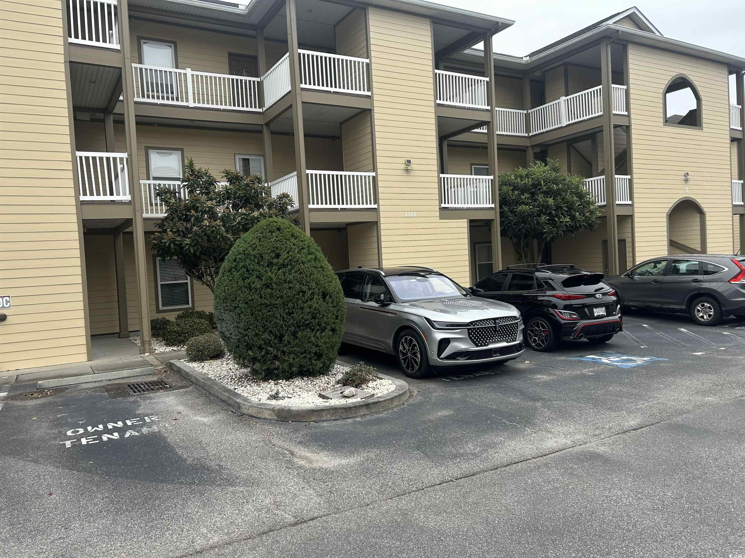 4104 Pinehurst Circle, Unit 2G Little River, SC 29566 - Photo 1 of 17 View of apartment building / complex with uncovered parking