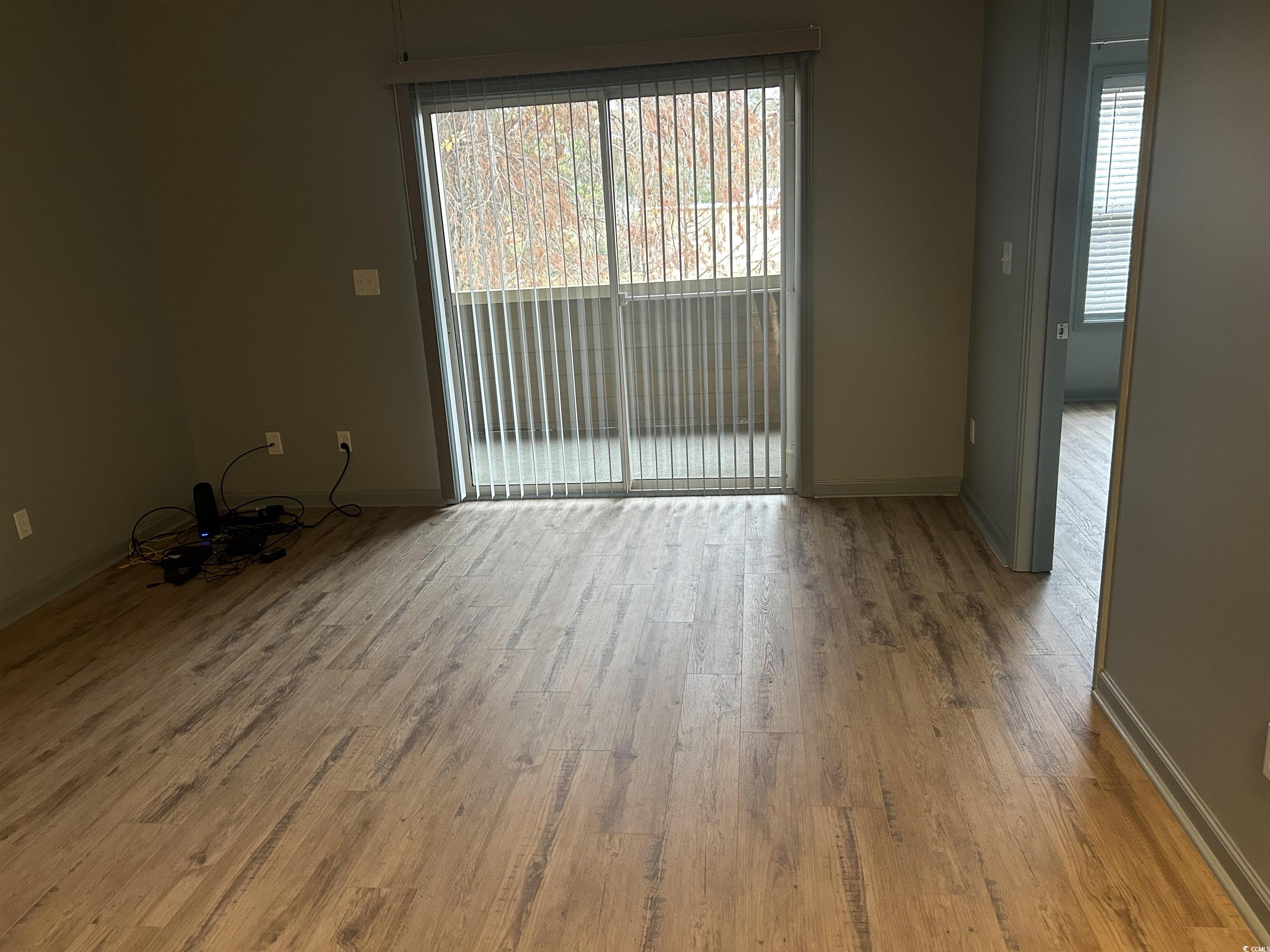 4104 Pinehurst Circle, Unit 2G Little River, SC 29566 - Photo 8 of 17 Unfurnished room featuring light wood finished floors and baseboards