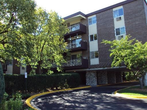 1301 South Finley Road, Unit 112 Lombard, IL 60148 - Photo 1 of 2 front view of a house with a yard