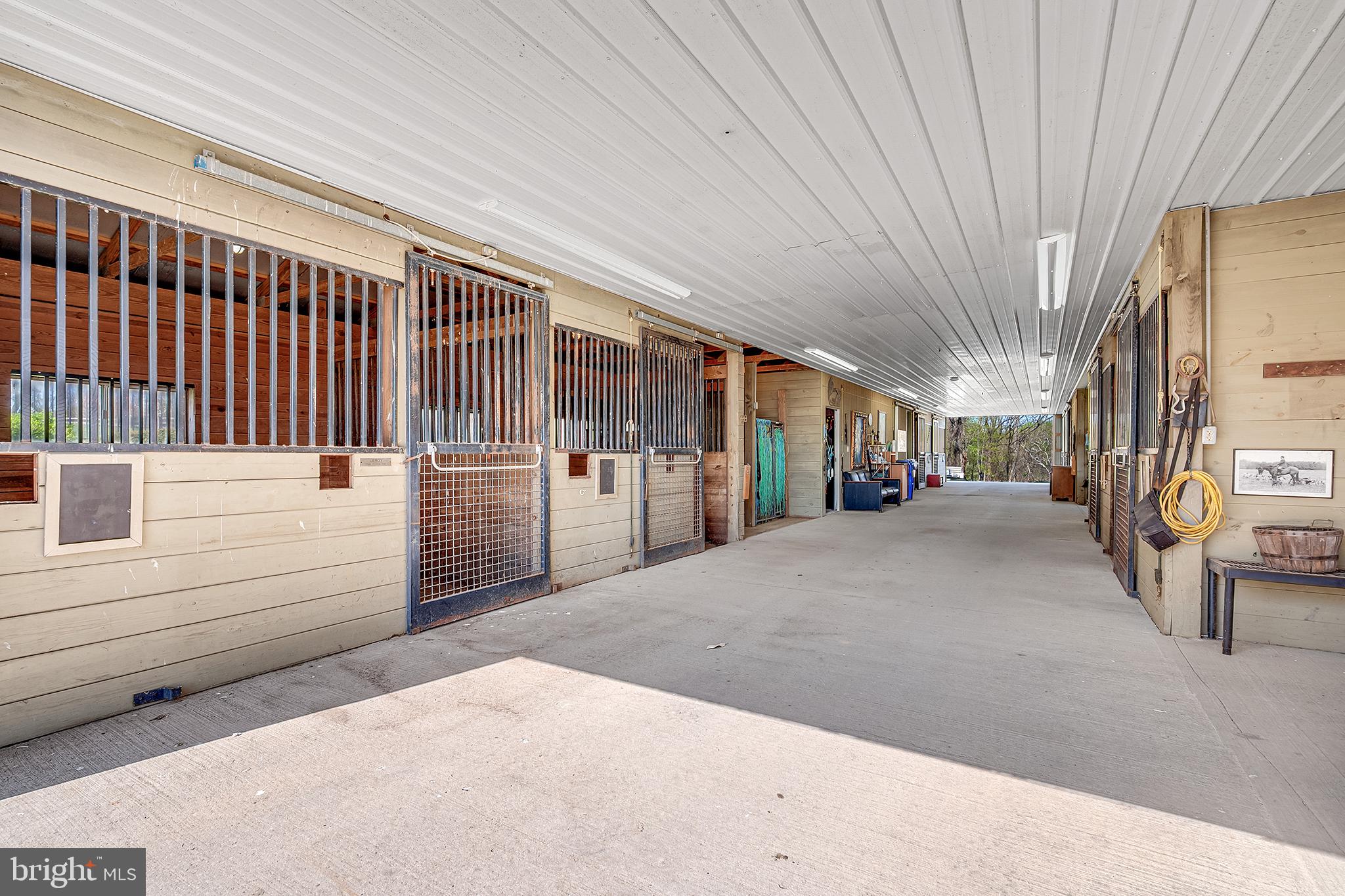 26100 Mullinix Mill Road Mount Airy, MD 21771 - Photo 81 of 99 Spacious equestrian facility corridor.