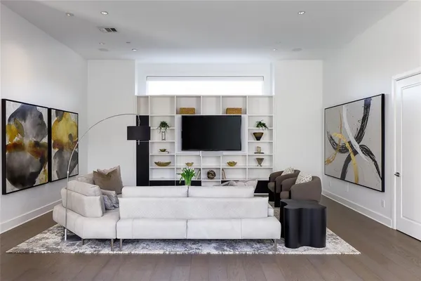 a living room with fireplace furniture and a flat screen tv