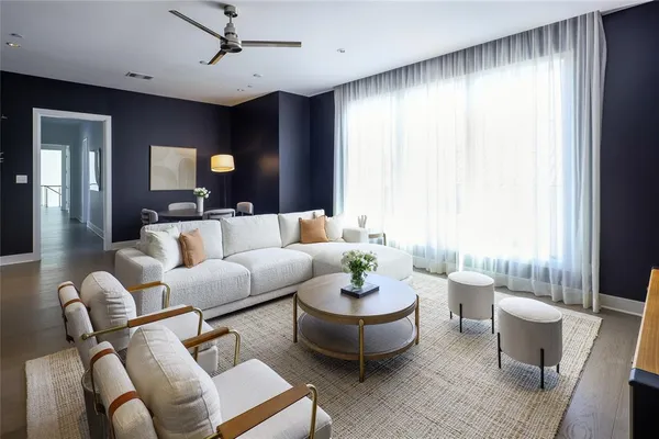a living room with furniture and a large window