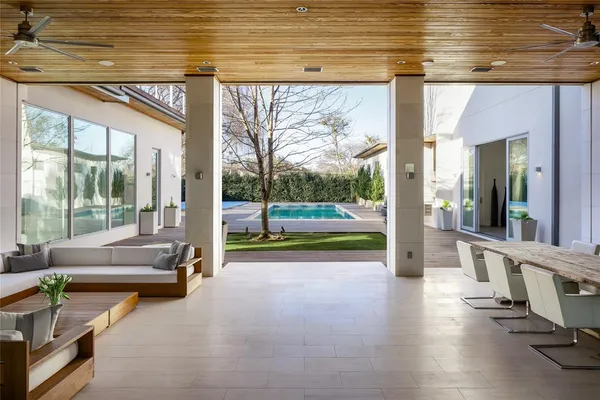 a view of swimming pool with outdoor seating