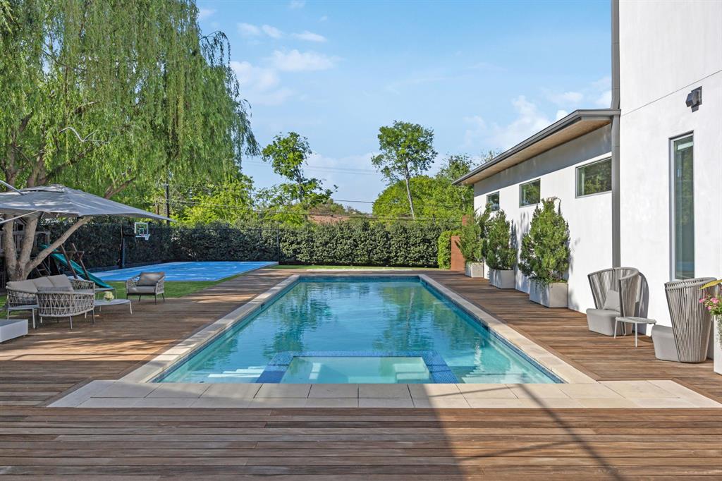 11565 East Ricks Circle Dallas, TX 75230 - Photo 33 of 39 Expansive wood deck with pool and gas fireplace
