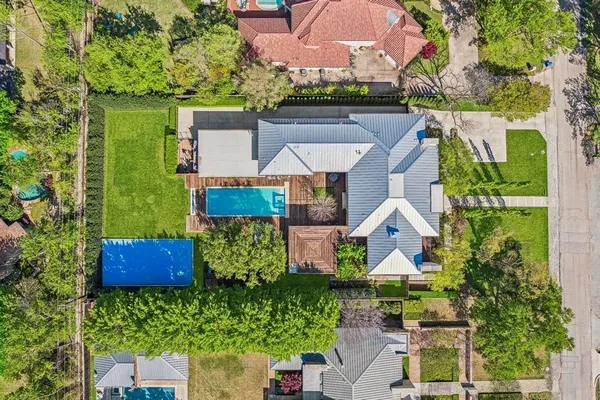 an aerial view of house with yard swimming pool and outdoor seating