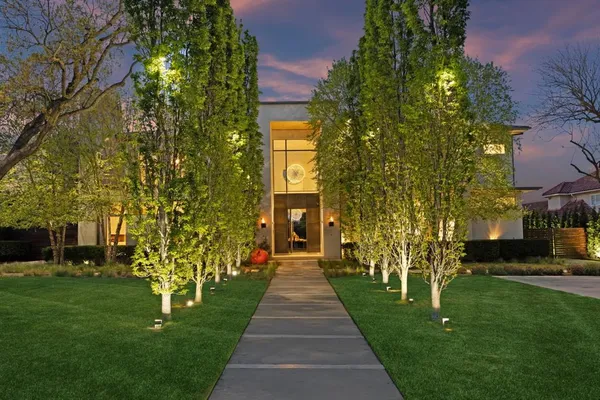 a front view of a house with garden