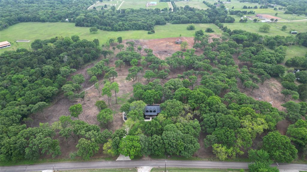 410 W Arkansas Road Sadler, TX 76264 - Photo 5 of 6 an aerial view of residential house with outdoor space and trees all around