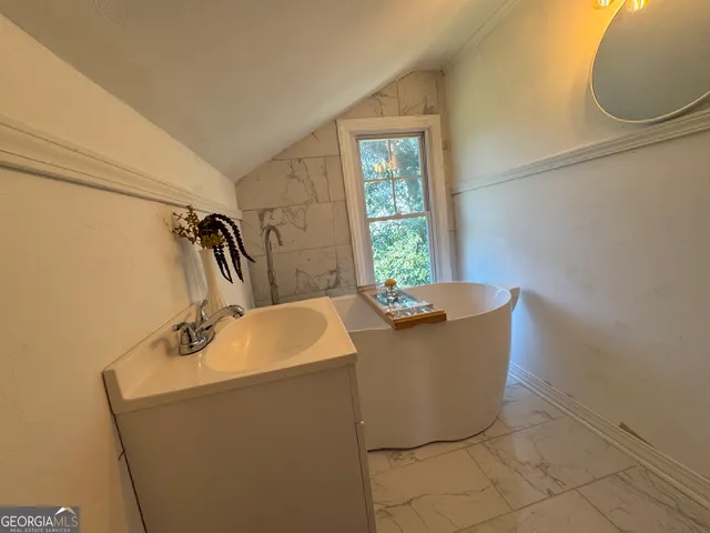 a living room with a couch and a window