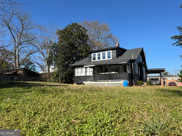 a view of a house with a big yard
