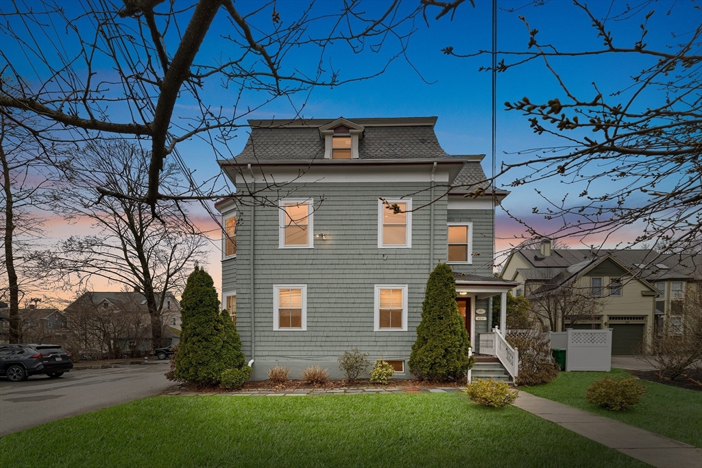 a view of a house with a yard