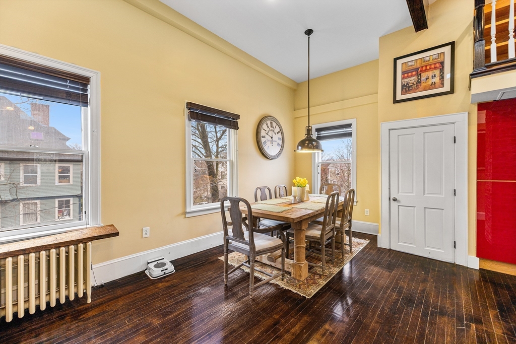 405 Cherry Street, Unit 2 Newton, MA 02465 - Photo 15 of 39 a view of a dining room with furniture window and wooden floor