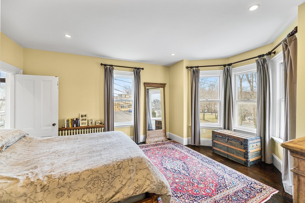 405 Cherry Street, Unit 2 Newton, MA 02465 - Photo 18 of 39 a bedroom with a large bed and a large window