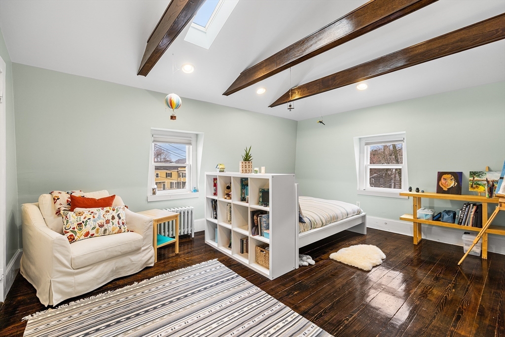 405 Cherry Street, Unit 2 Newton, MA 02465 - Photo 24 of 39 a bedroom with furniture and a wooden floor