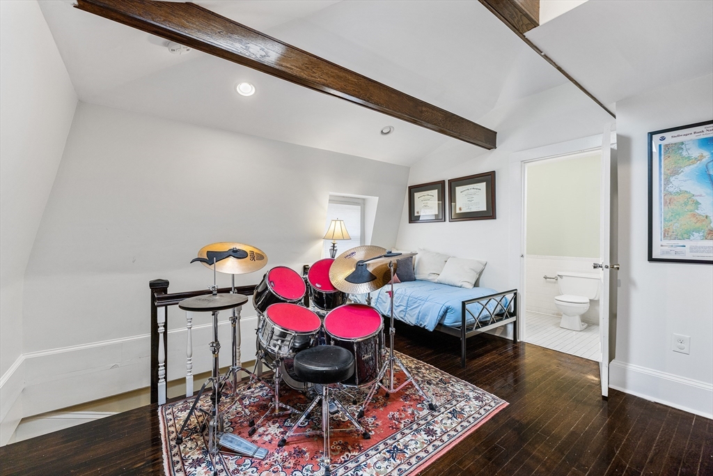 405 Cherry Street, Unit 2 Newton, MA 02465 - Photo 27 of 39 a living room with a baby crib furniture and a table