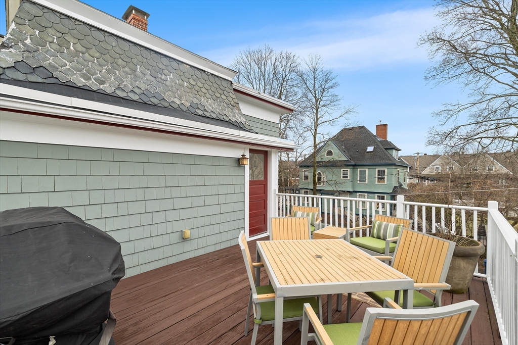405 Cherry Street, Unit 2 Newton, MA 02465 - Photo 33 of 39 a view of a wooden chairs and table in the deck
