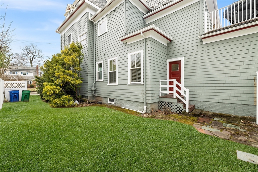 405 Cherry Street, Unit 2 Newton, MA 02465 - Photo 35 of 39 a view of a house with a yard