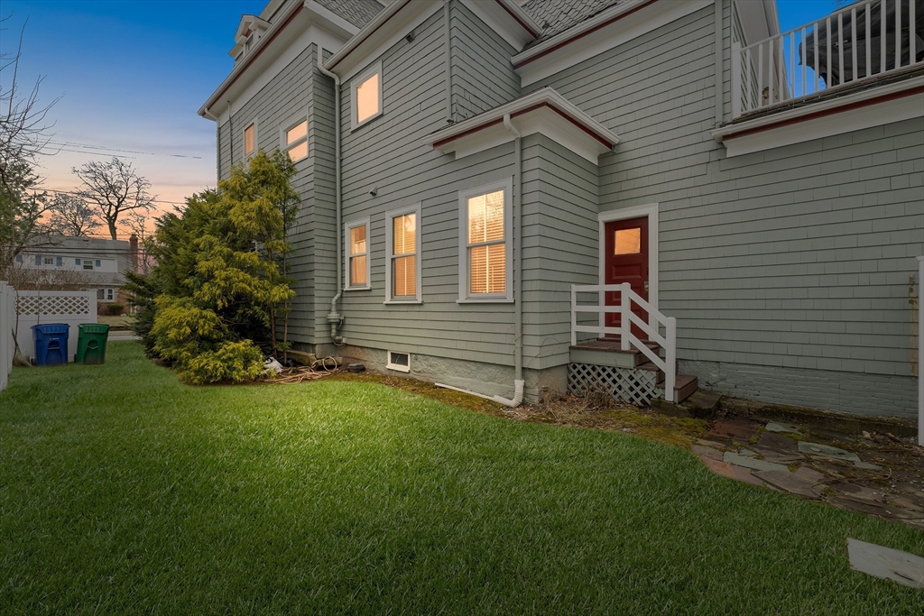 405 Cherry Street, Unit 2 Newton, MA 02465 - Photo 36 of 39 a front view of a house with a garden