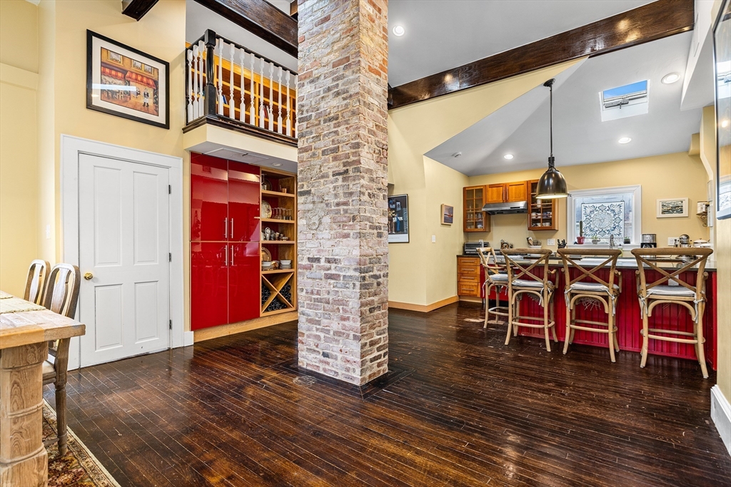 405 Cherry Street, Unit 2 Newton, MA 02465 - Photo 9 of 39 a view of a dining room with furniture and wooden floor