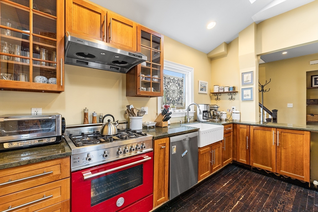 405 Cherry Street, Unit 2 Newton, MA 02465 - Photo 10 of 39 a kitchen with stainless steel appliances granite countertop a stove a sink and a microwave