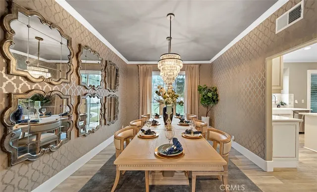 a spacious bathroom with a double vanity sink a large mirror and a bathtub