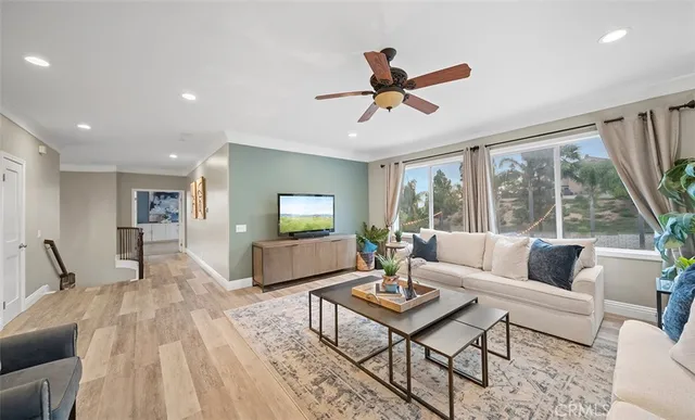 a bathroom with a toilet a sink and a large mirror