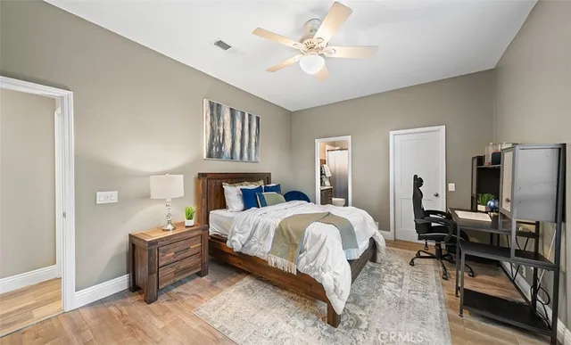 a view of a swimming pool with lawn chairs under an umbrella