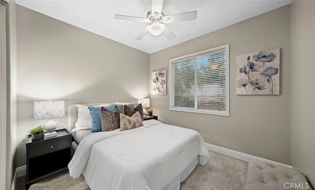 a view of benches with trees in front of it