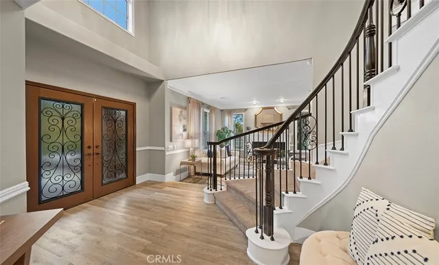 a view of entryway livingroom and hall with wooden floor