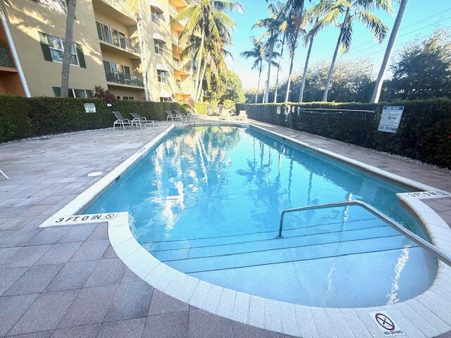 1650 Presidential Way, Unit 506 West Palm Beach, FL 33401 - Photo 2 of 15 a view of swimming pool from a balcony
