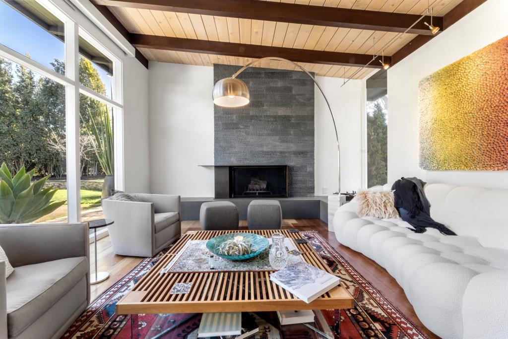 Undisclosed Address Stanford, CA 94305 - Photo 17 of 45 a living room with furniture and a fireplace